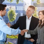 Businesspeople meeting outside of office